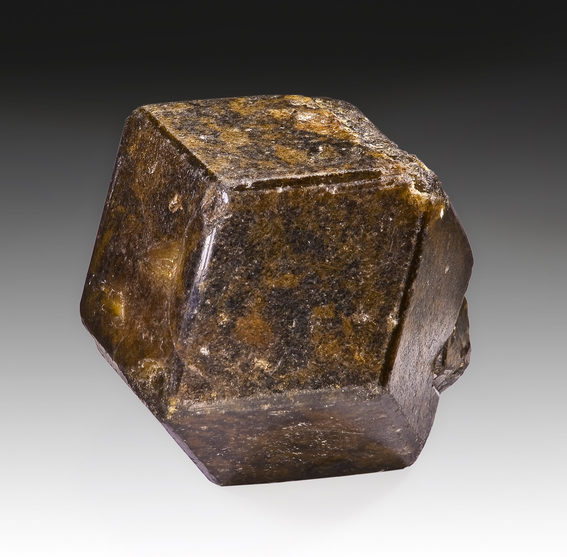 Green andradite garnet faceted specimen showing exceptional brilliance and fire