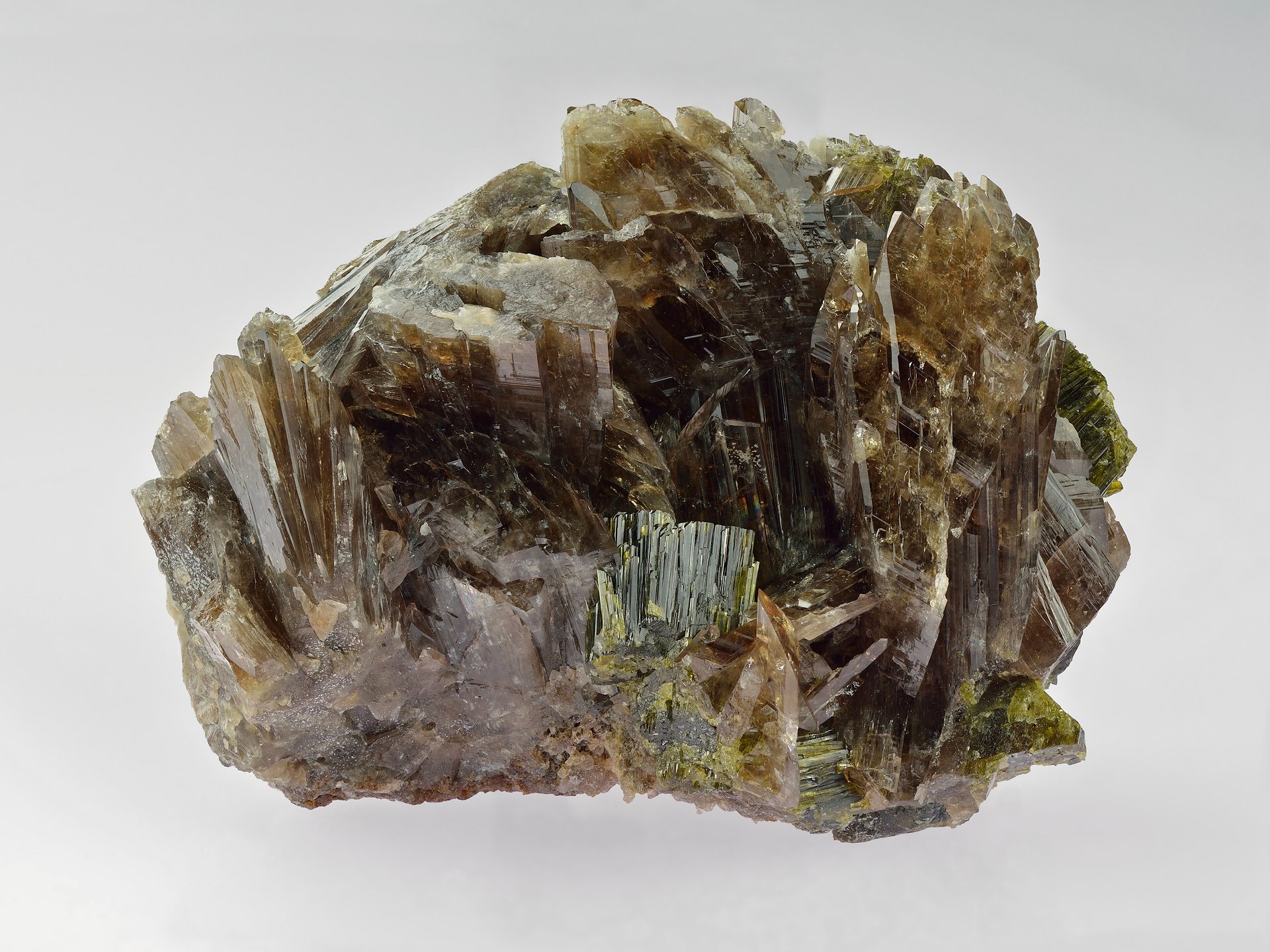 Faceted axinite gemstone showing characteristic brown-violet color with strong pleochroism
