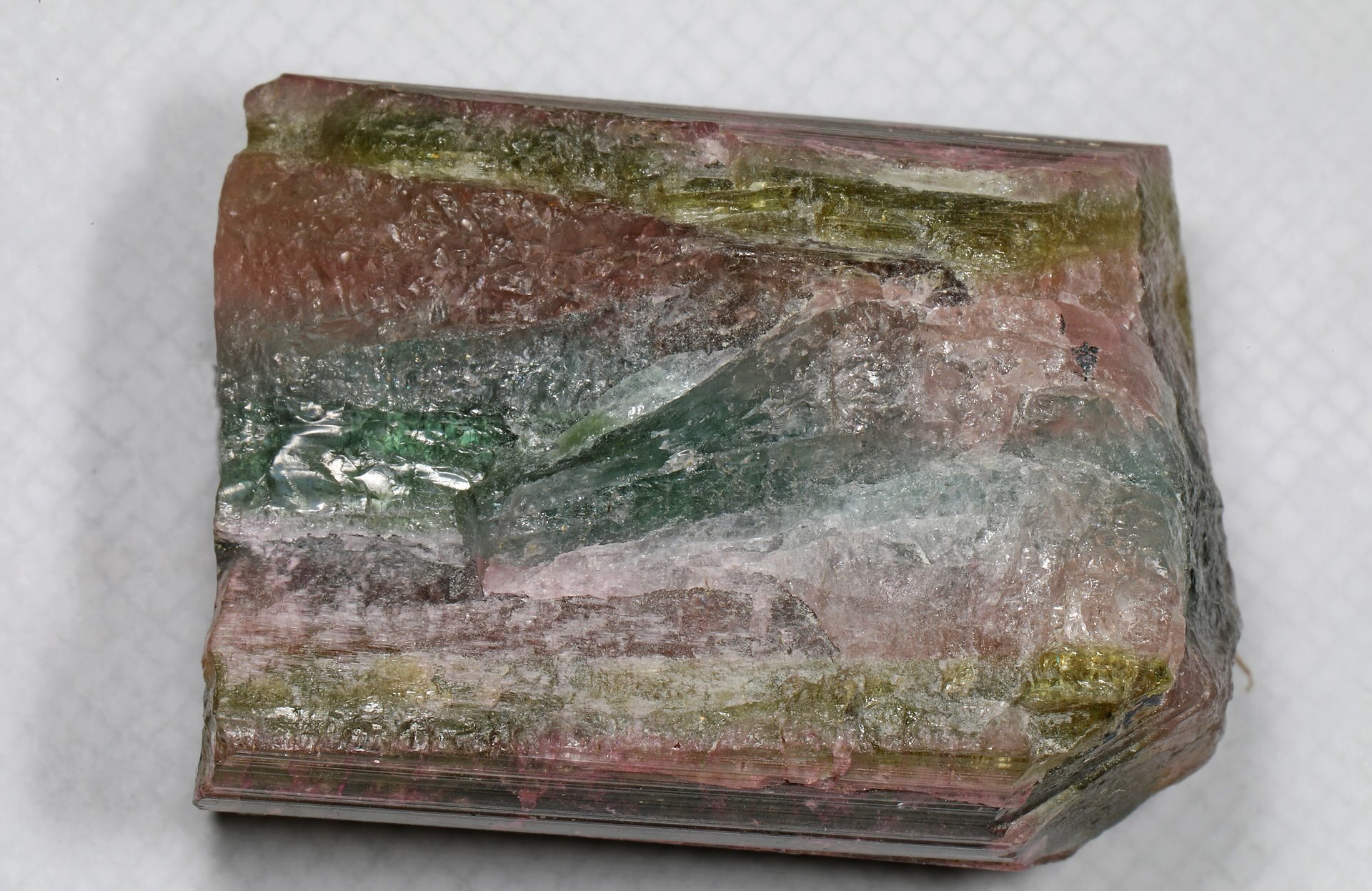 Bi-color tourmaline crystal showing pink and green zones in a single specimen