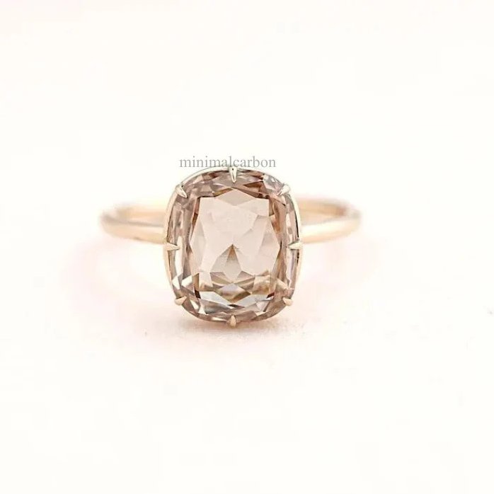 Faceted brown diamond showing warm cognac color with diamond brilliance and fire