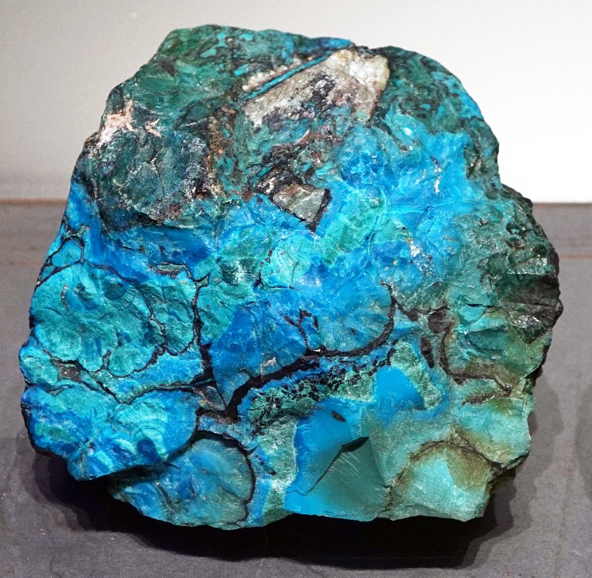 Polished Eilat stone showing swirling blue, green, and turquoise patterns