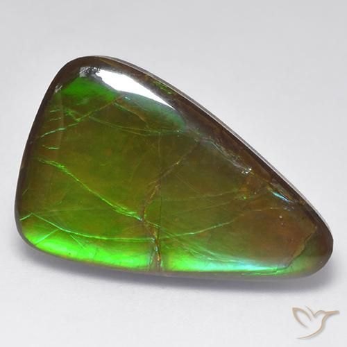 Raw pistachio-green epidote crystal cluster on neutral background