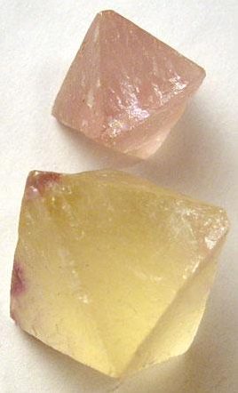 Raw fluorite specimen showing natural cubic cleavage in purple and green colors