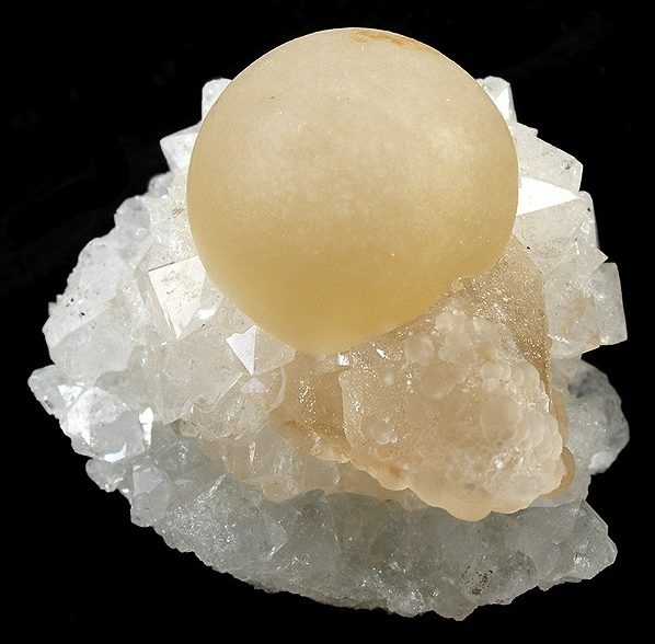 Fluorite sphere showing multicolor banding of purple, green, and blue fluorite in polished ball form