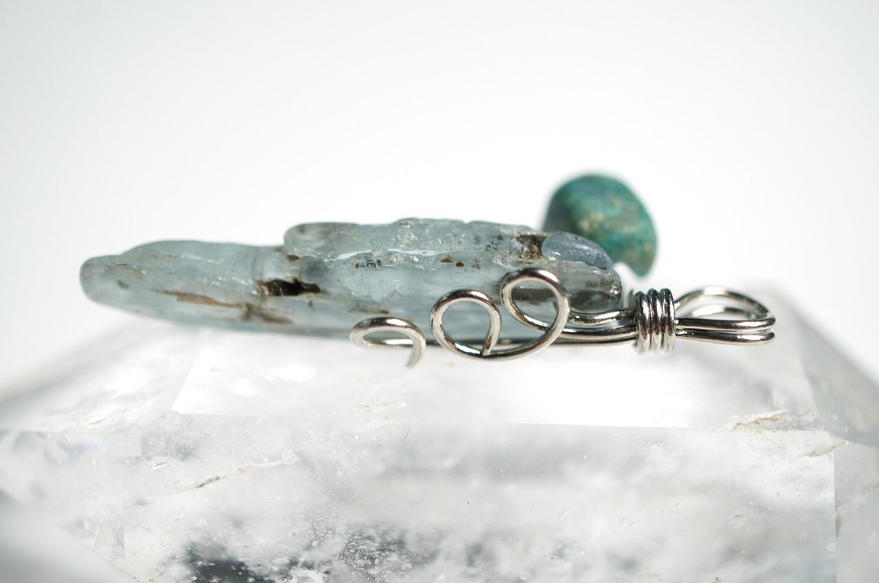 Green kyanite blade crystals showing translucent sage green color