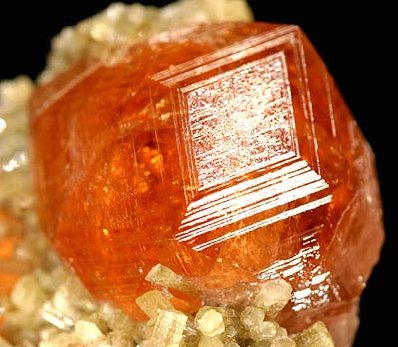 Grossular garnet faceted specimens showing multiple colors including green hessonite and mint