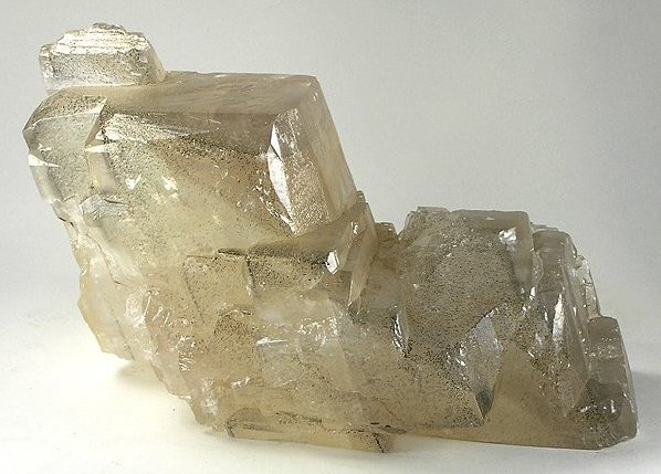 Polished Honey Calcite cluster showing translucent golden-amber calcium carbonate crystals with warm honey glow