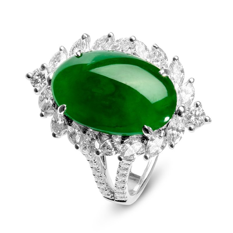 Imperial jade polished cabochon showing vivid translucent emerald green color on neutral background