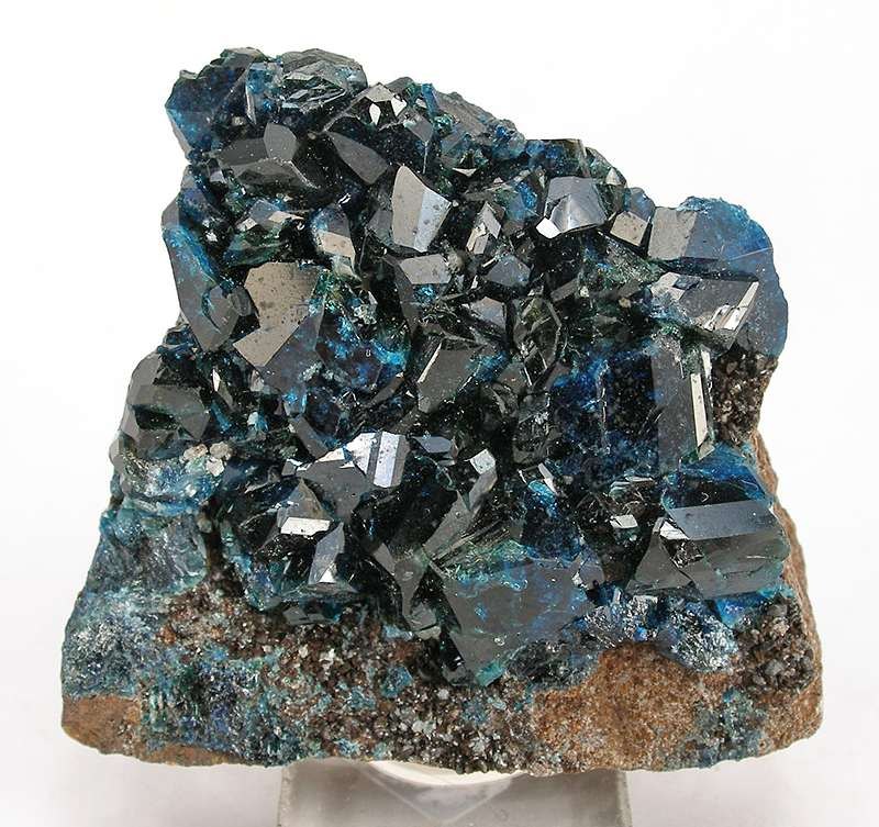 Lazulite faceted deep azure blue gemstone rare phosphate on neutral background