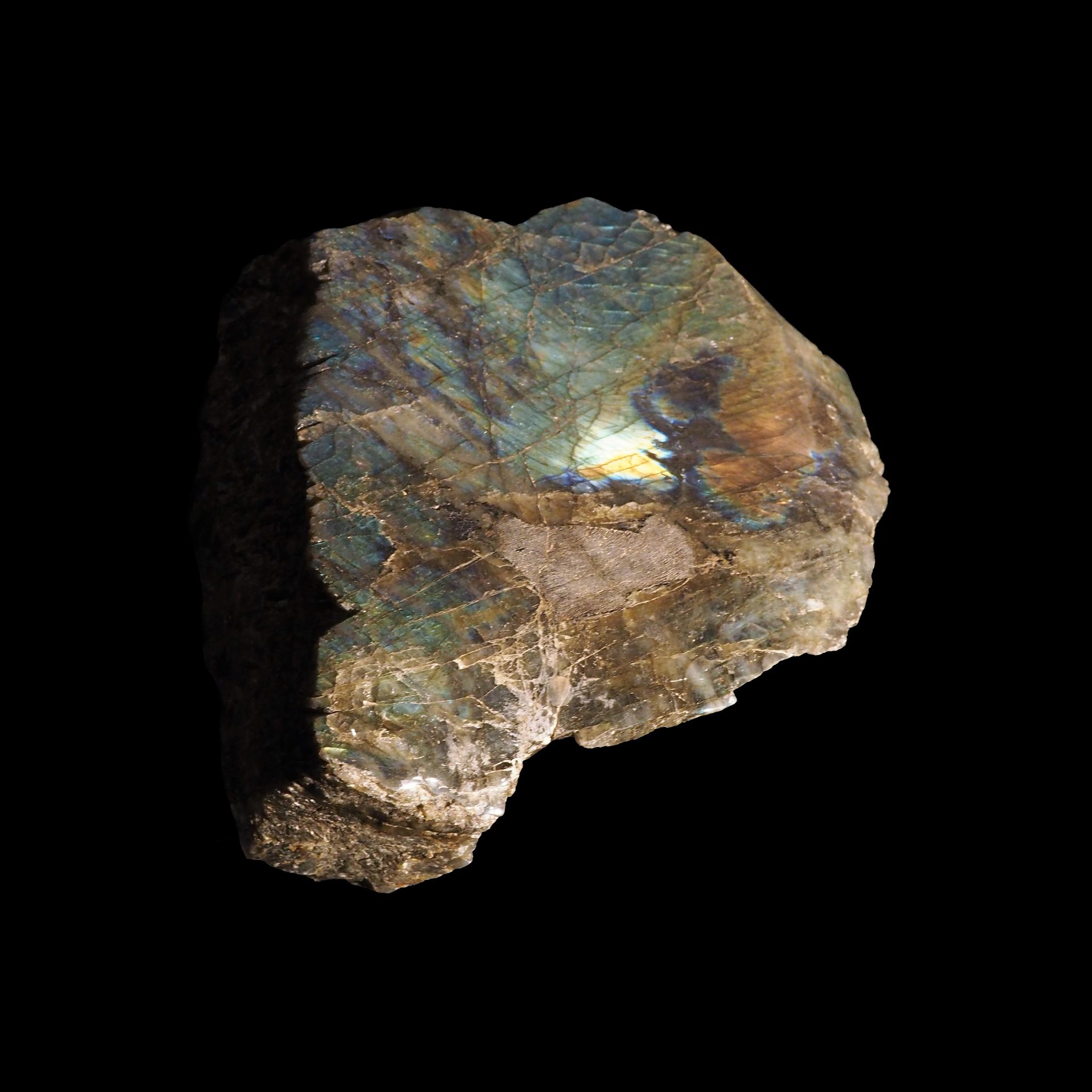 Polished Madagascar labradorite cabochon showing vivid blue-green labrescence flash