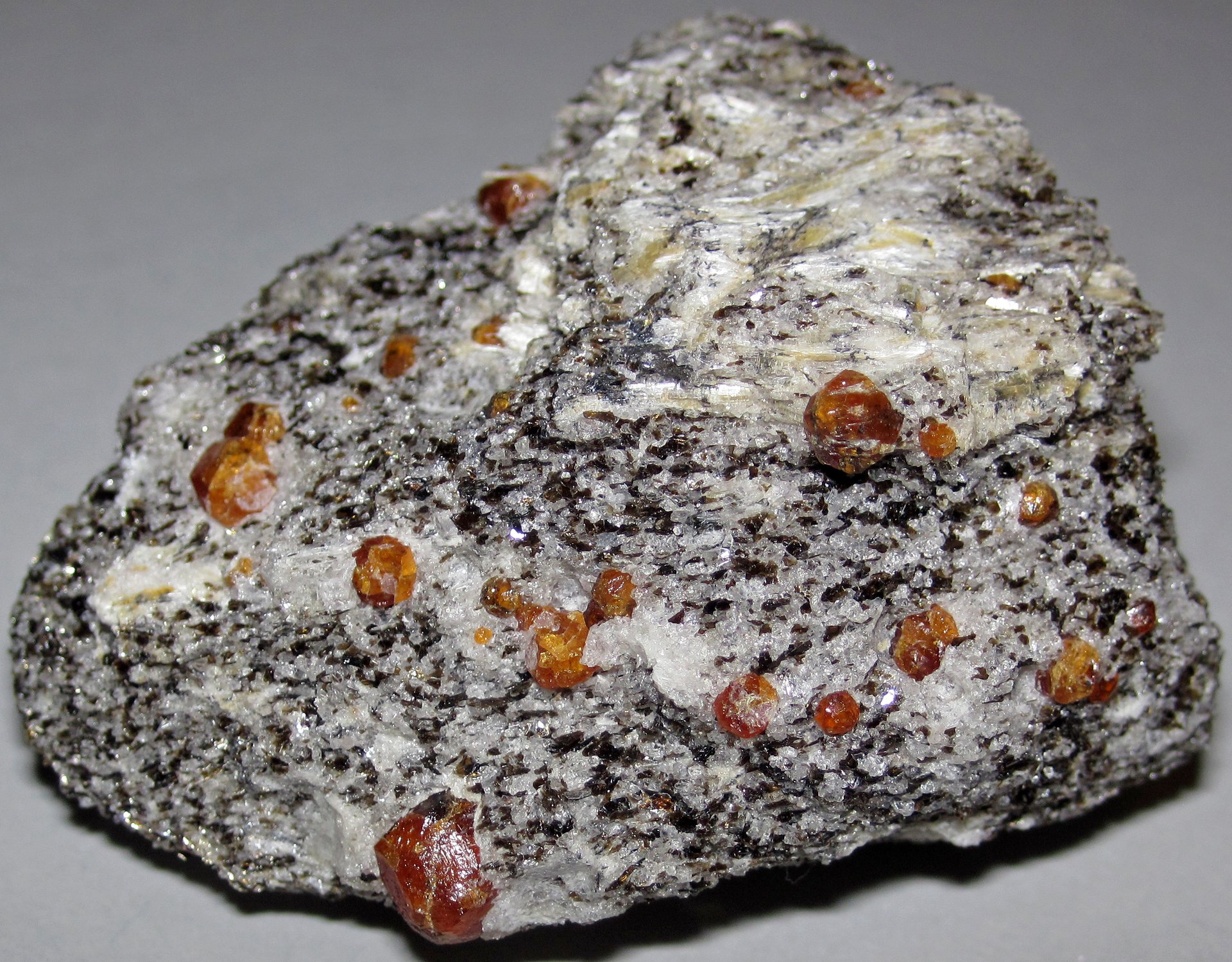 Mandarin garnet faceted gemstone showing vivid pure orange color