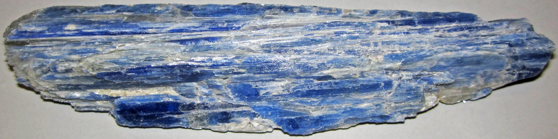 Orange kyanite blade crystal from Tanzania showing warm apricot-orange color