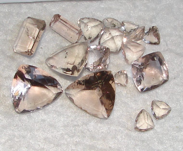 Polished pink fluorite sphere with soft rose-pink translucency