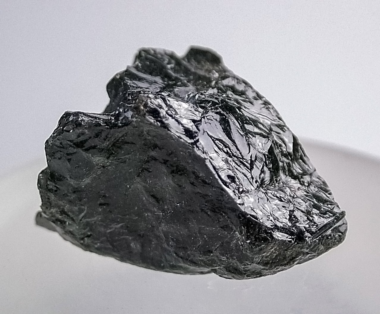 Schorl black tourmaline crystals on white quartz matrix showing vertical striations and deep black luster