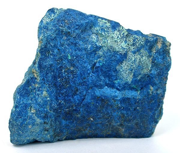 Shattuckite polished cabochon showing deep blue fibrous structure natural copper silicate on neutral background
