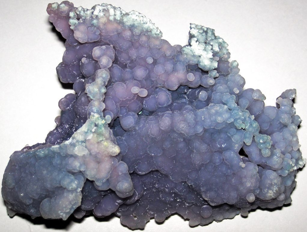 Super Seven crystal cluster showing purple amethyst, smoky quartz, clear quartz with rutile and goethite needles from Brazil