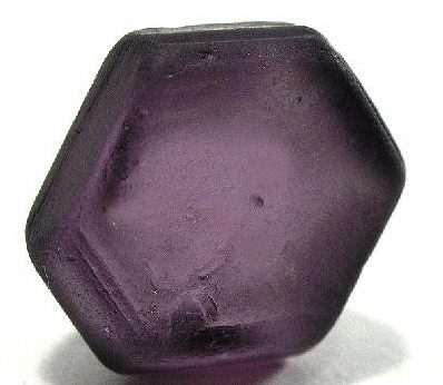 Taaffeite faceted gemstone showing lavender to pale purple color with brilliant facets