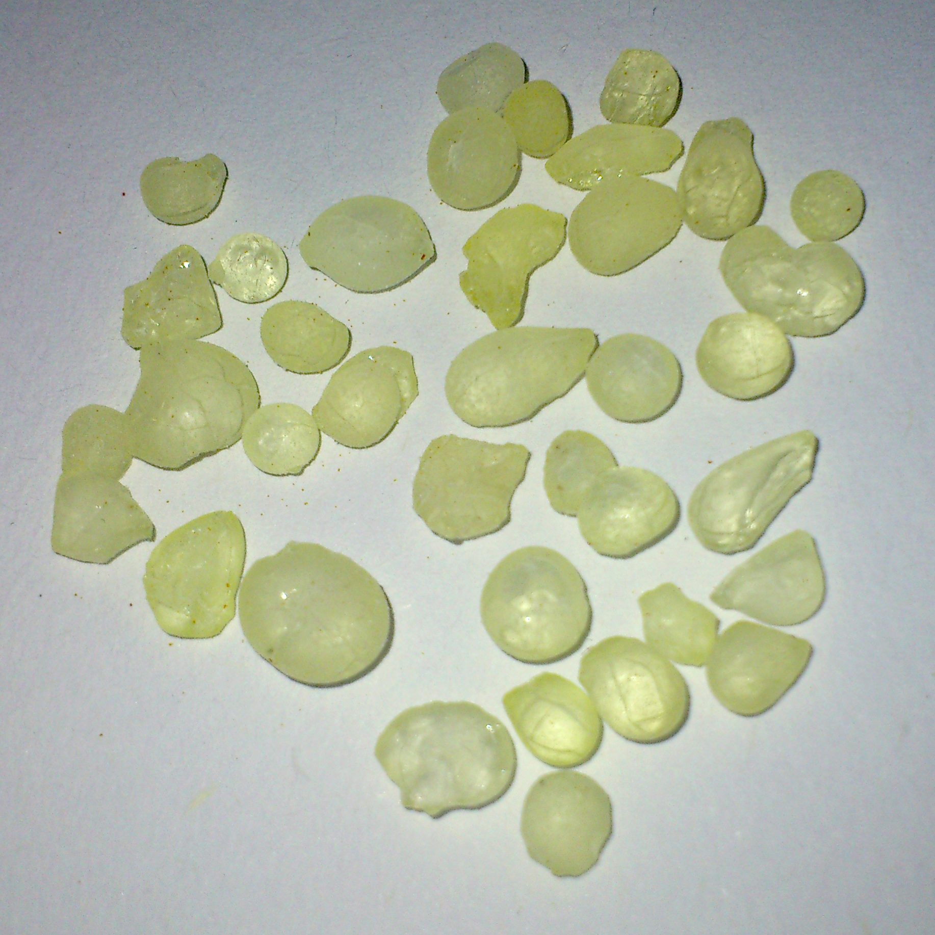 Faceted yellow apatite gemstone showing warm golden yellow color
