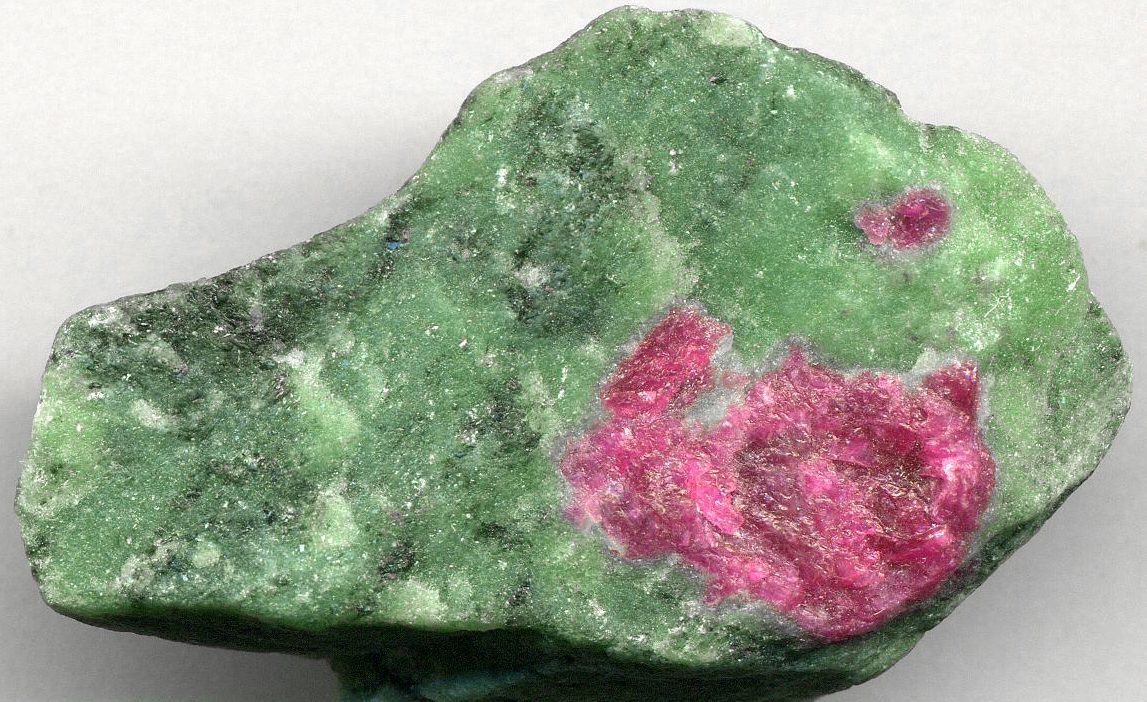 Zoisite with Ruby specimen showing vivid green zoisite and red ruby on neutral background